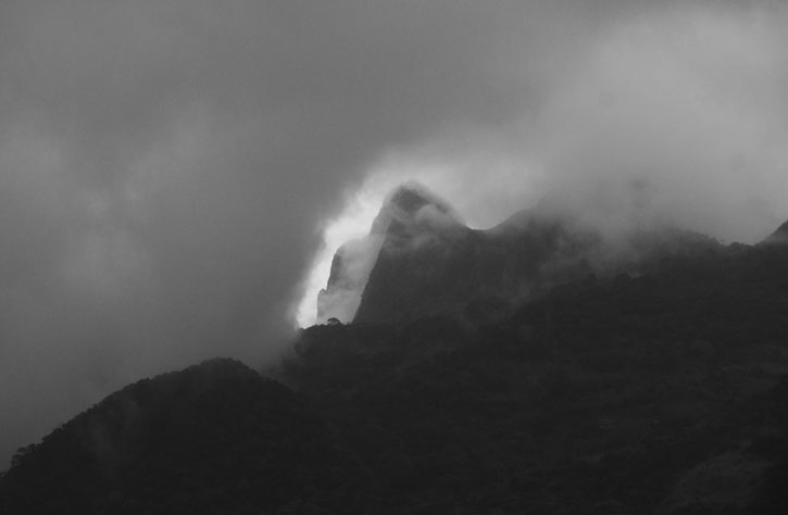Black and White Photo of mountain with clouds